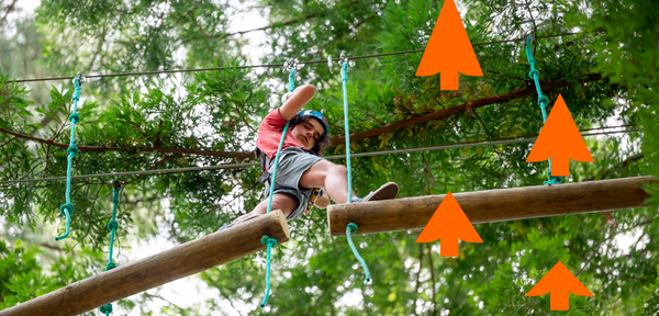 Boy on high ropes course